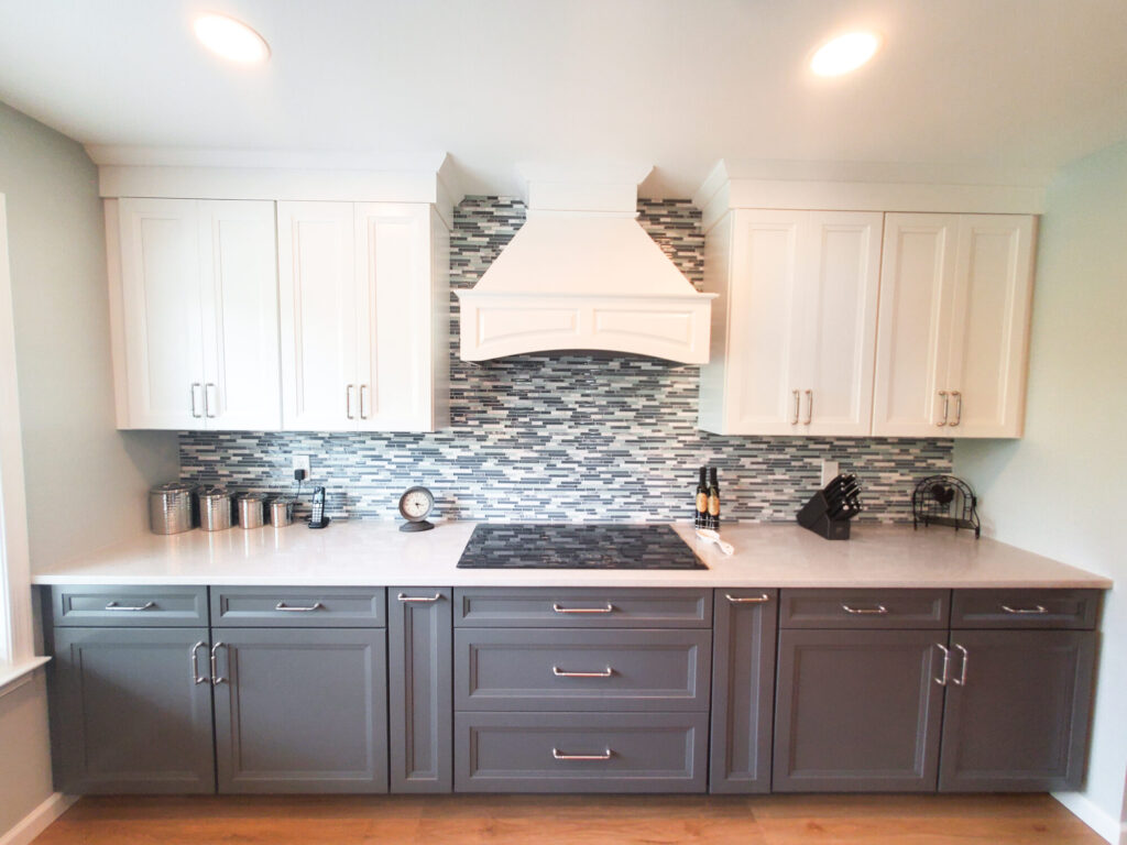 custom kitchen backsplash with gray cabinet lowers
