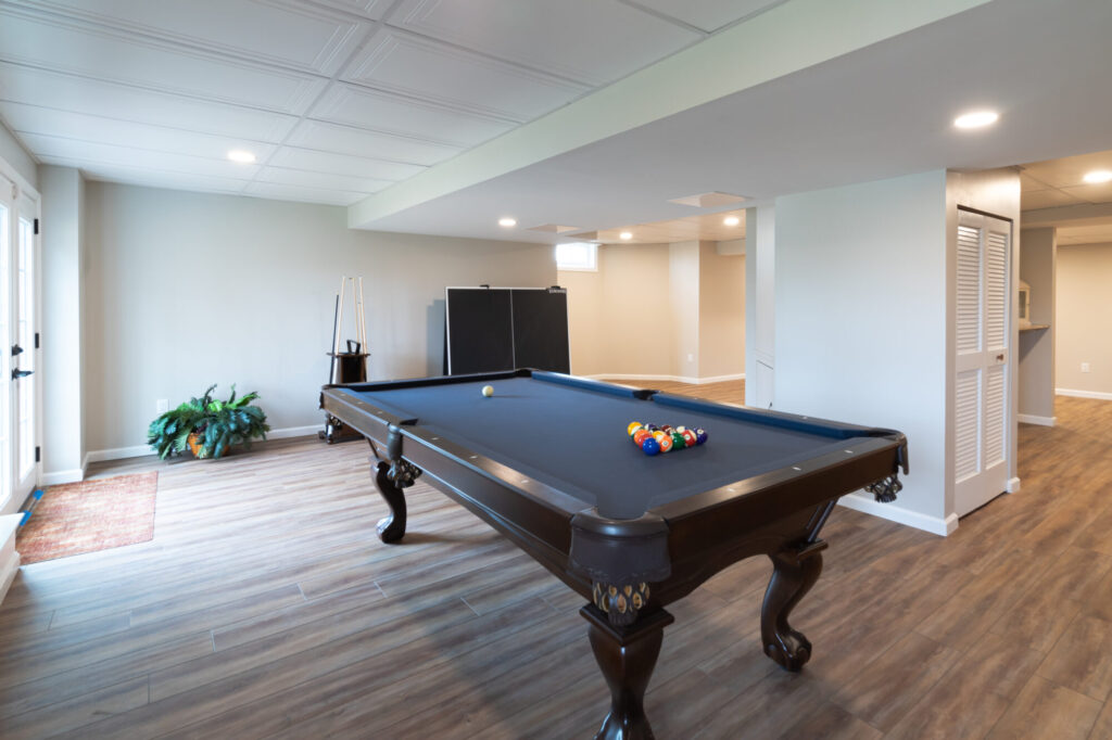 refinished basement remodel with pool table